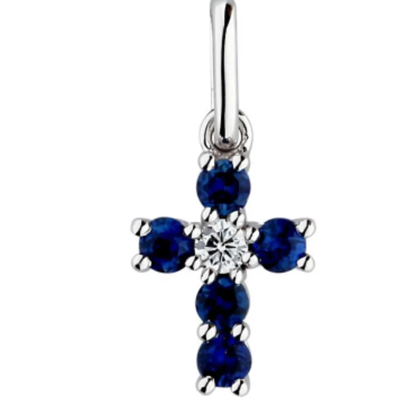 14KWG BR 0.03CTW DIA & 0.20CTW EMERALD PRONG SET CROSS PENDANT.