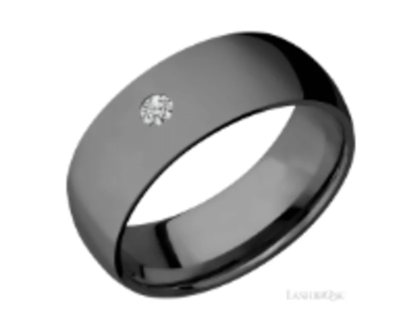 Black zirconium 8mm domed band with one round diamond that is .10ct flush set. SATIN