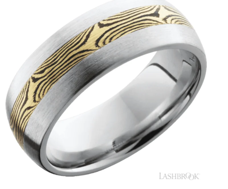 Cobalt chrome 8mm domed band with one inlay that is 3mm wide of the mokume that is made from 14k y